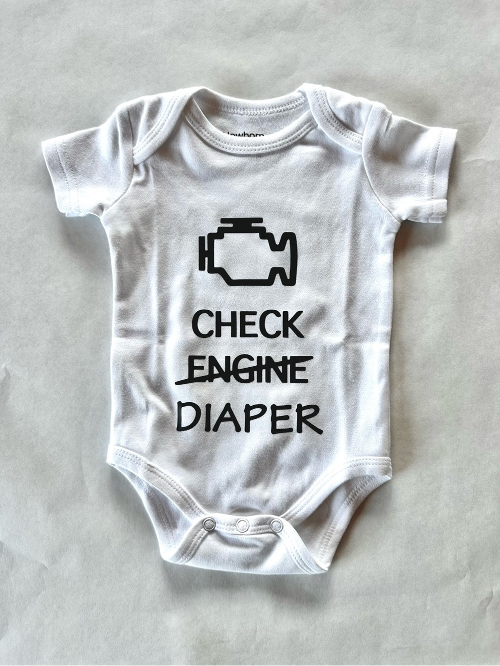 NWOT White 'Check Diaper' Baby Onesie - Playful Graphic Bodysuit